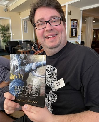 George Mann with a copy of his Absinthe novella Broken Things - A Tale of Durstan at ChillerCon UK