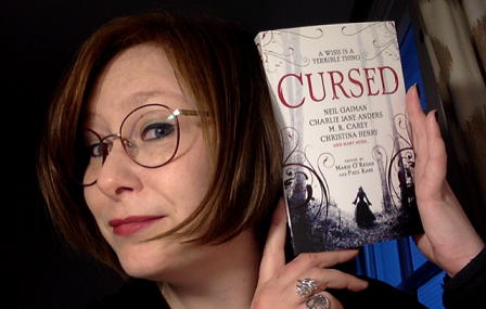 Jen Williams with contributor's copy of Cursed, edited by Marie O'Regan and Paul Kane
