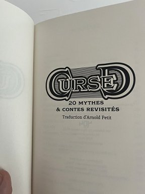 pphotograph of the title page of the French edition of Cursed, edited by Marie O'Regan and Paul Kane