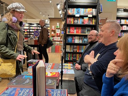 Tom Mead, Russ Thomas and Marie O'Regan talking to a customer