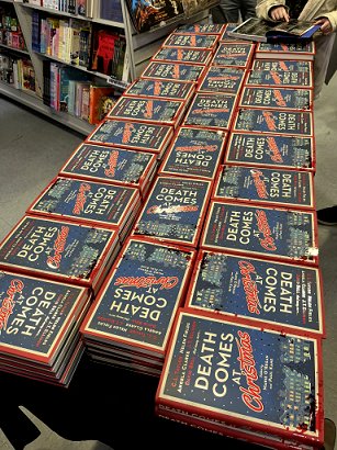 photograph of a display of many copies of Death Comes at Christmas, edited by Marie O'Regan and Paul Kane, ready for signing at Forbidden Planet London Megastore