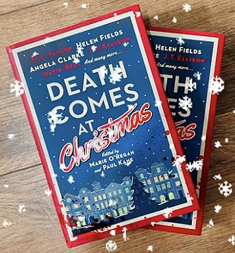 photograph showing two copies of Death Comes at Christmas, edited by Marie O'Regan and Paul Kane, on a wooden surface with snow falling