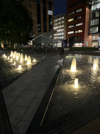 image of a spotlit fountain at night