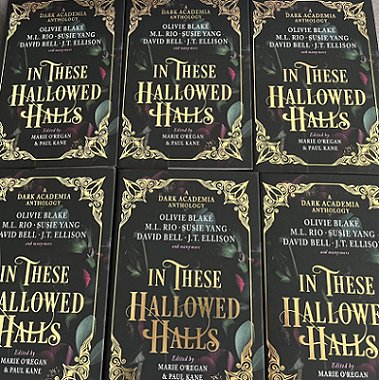 display of six copies of In These Hallowed Halls, edited by Marie O'Regan and Paul Kane, lying flat