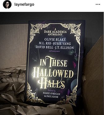 screenshot of an image of In These Hallowed Halls, edited by Marie O'Regan and Paul Kane, on top of an open cardboard box with brown tissue paper. Layne Fargo's contributor copy