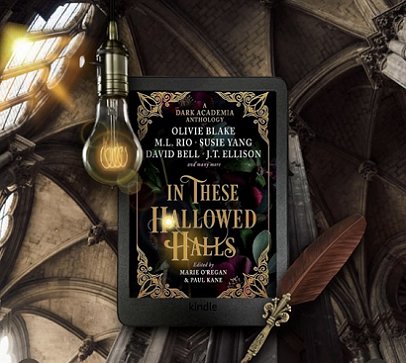 Image showing a black Kindle displaying the cover of In These Hallowed Halls, edited by Marie O'Regan and Paul Kane, against the background of a dark vaulted ceiling, a dim lightbulb, a quill pen and a mullioned window