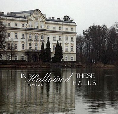 photograph showing palatial white four-storey building by a lake, surrounded by trees. Text reads In These Hallowed Halls reviews Part One