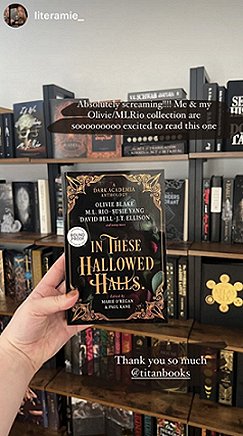 Image of a woman's hand holding a copy of In These Hallowed Halls, edited by Marie O'Regan and Paul Kane, up against a background of crowded bookshelves