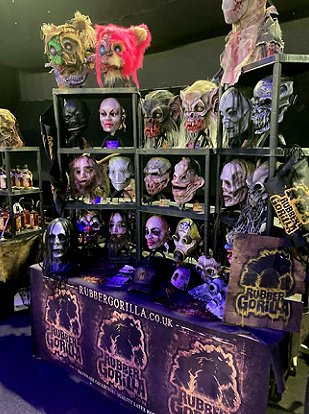Stall featuring model heads of various movie monsters at HorrorCon UK