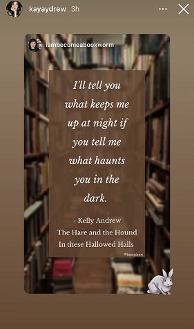 screenshot from @kayaydrew. Image is of two lines of bookshelves, with text superimposed. Text reads I'll tell you what keeps me up at night if you tell me what haunts you in the dark. Kelly Andrew. The Hare and the Hound. In These Hallowed Halls
