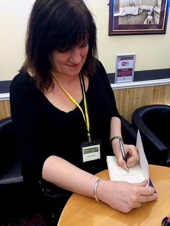 Marie signing copies of In Times of Want