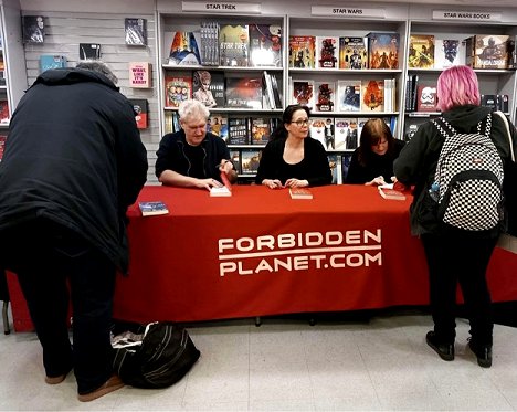Paul Kane, Helen Grant and Marie O'Regan signing customers' copies of Twice Cursed, edited by Marie O'Regan and Paul Kane