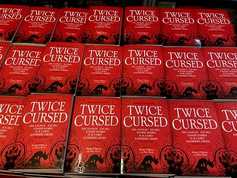 Display of multiple copies of Twice Cursed, edited by Marie O'Regan and Paul Kane