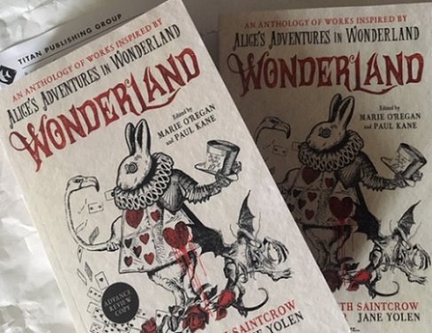 Advance review copies of Wonderland, edited by Marie O'Regan and Paul Kane