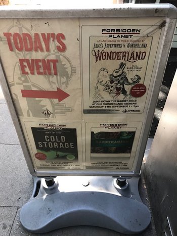 Outside sign for the Wonderland signing at Forbidden Planet, London megastore