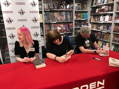 L to R: Laura Mauro, Marie O'Regan and Mike Carey signing copies of Wonderland