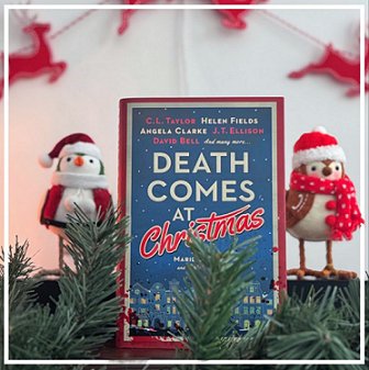 photograph of a copy of Death Comes at Christmas, edited by Marie O'Regan and Paul Kane, standing between a robin and a penguin dressed in Christmas scarves and hats, behind pine leaves and in front of a white background with a red reindeer garland strung across it