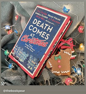 photograph of a copy of Death Comes at Christmas, edited by Marie O'Regan and Paul Kane, on a green blanket decorated with twinkling lights and a gingerbread man with the head bitten off