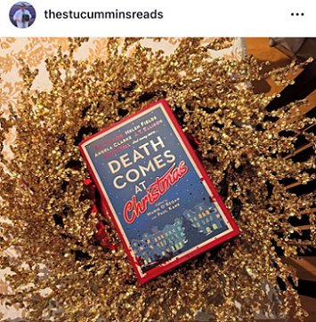 screenshot showing a copy of Death Comes at Christmas, edited by Marie O'Regan and Paul Kane, lying on a golden wreath